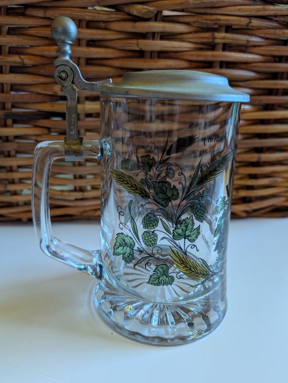 vintage German glass beer stein decorated with a traditional "Hopfen und Malz"